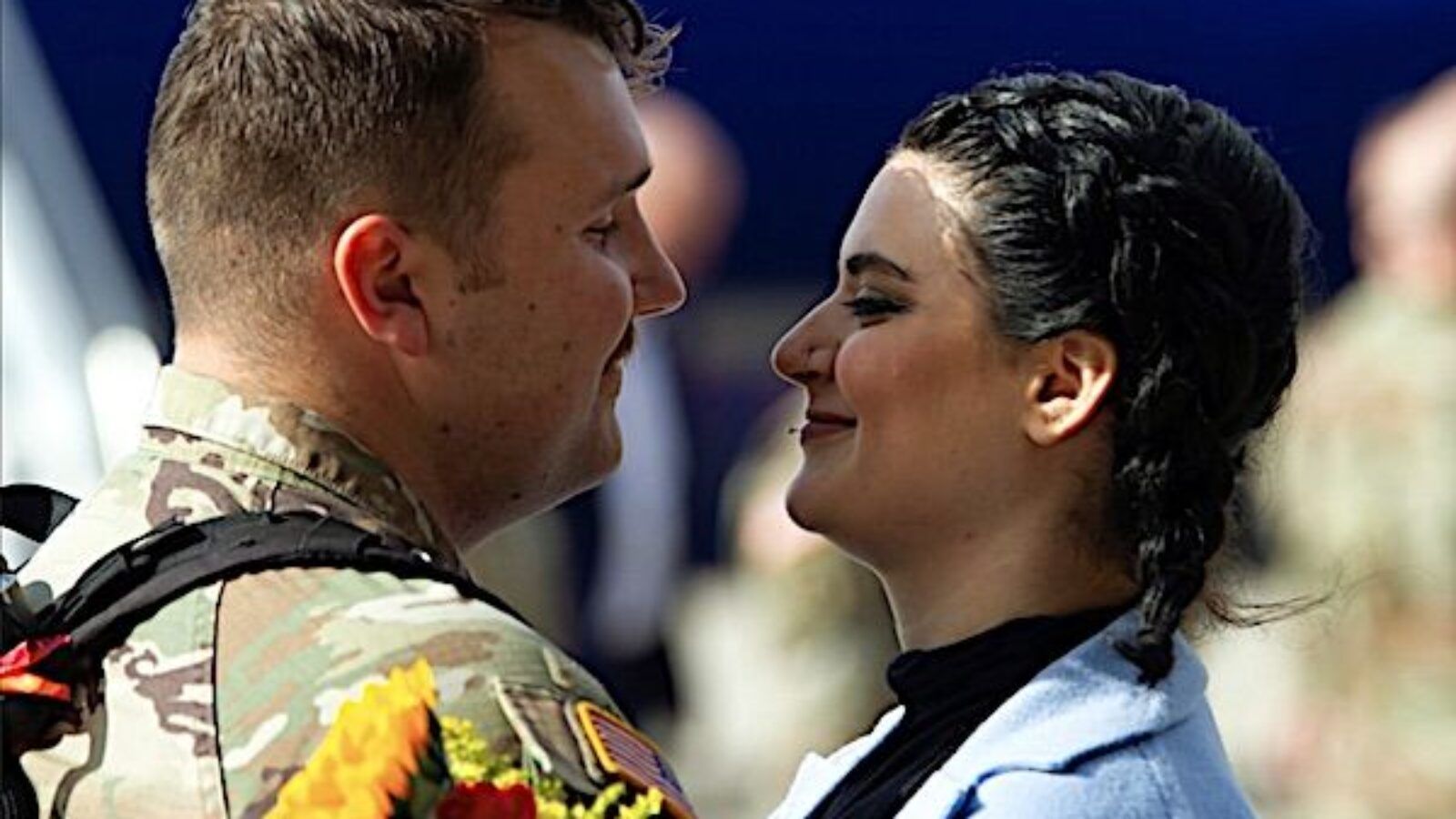 A National Guardsman embraces a loved one at Roland R. Wright Air National Guard Base, Salt Lake City, Nov. 4, 2021, after returning from deployment. (U.S. Air Force photo by Master Sgt. John Winn, National Guard)